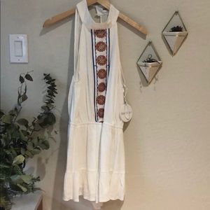 White romper with halter neck & embroidery detail